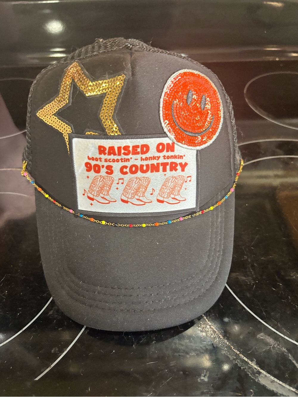 OTTO Black Trucker Hat with Orange Smiley and Gold Star Patch